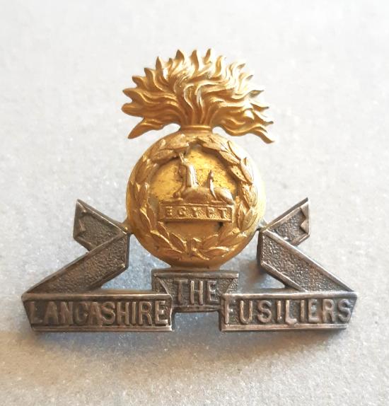 THE LANCASHIRE FUSILIERS GILT & SILVER PLATE Officer’s Hat Badge