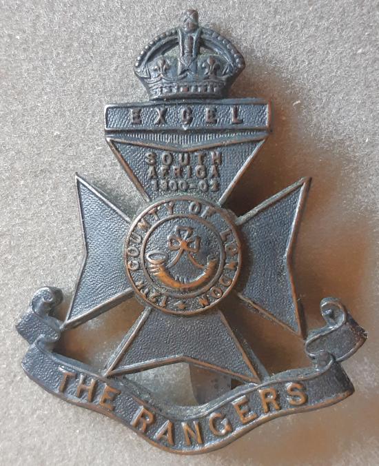 BRITISH - 12th County of London Battalion (The Rangers) Blackened Hat Badge (KK1835)